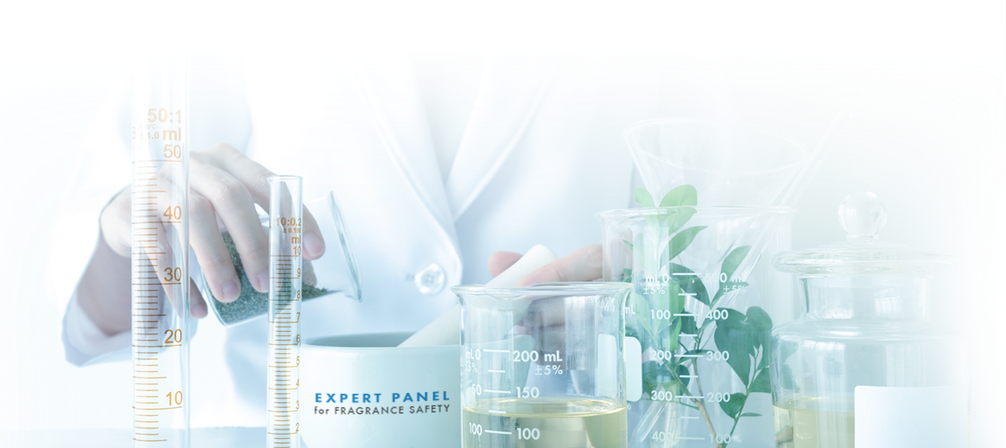 Expert panelist evaluating fragrance safety with a mortar and pestle, beakers and test tubes